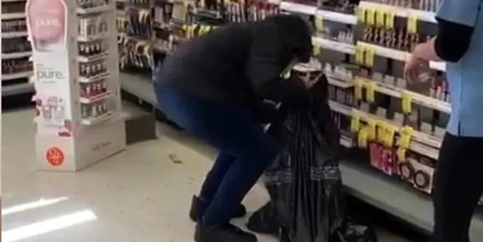 Theft of goods from supermarket shelves