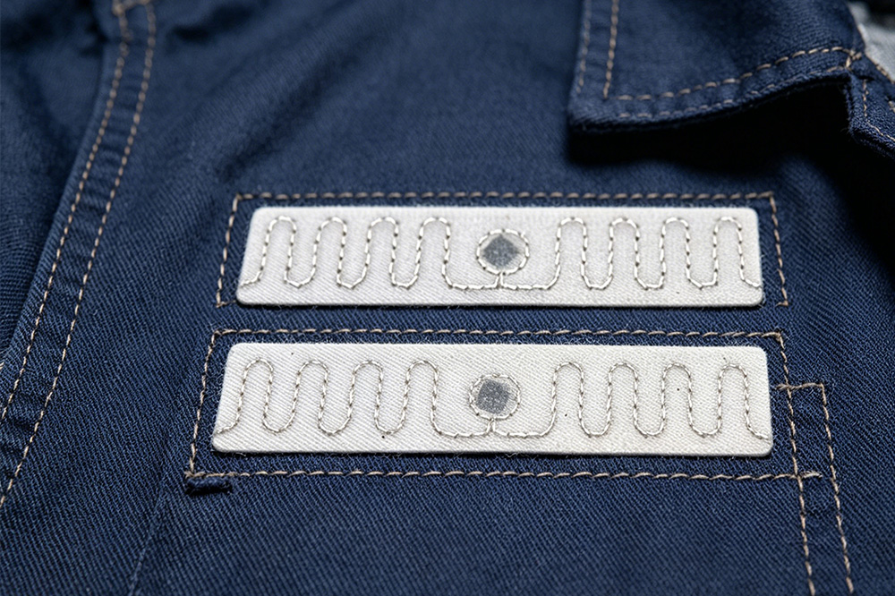Why Uniform Rental Companies Are Switching to RFID Laundry Tags 1 Washable RFID laundry tag attached to industrial uniform