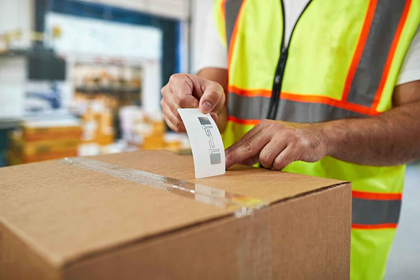 UHF RFID label attached to a cardboard shipping carton in a European warehouse