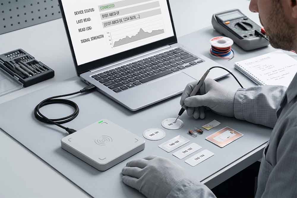 USB RFID Reader Troubleshooting: Common Problems and Solutions 1 Technician testing RFID tag compatibility with a USB RFID reader
