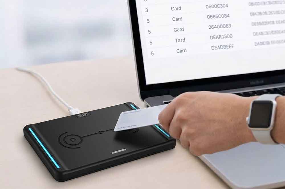USB RFID reader connected to a computer for RFID tag communication testing.
